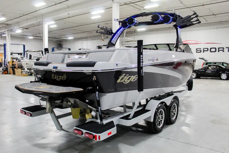 Slide: The Image of 2025 Tigé Z3 boat on trailer in indoor showroom setting. - 5