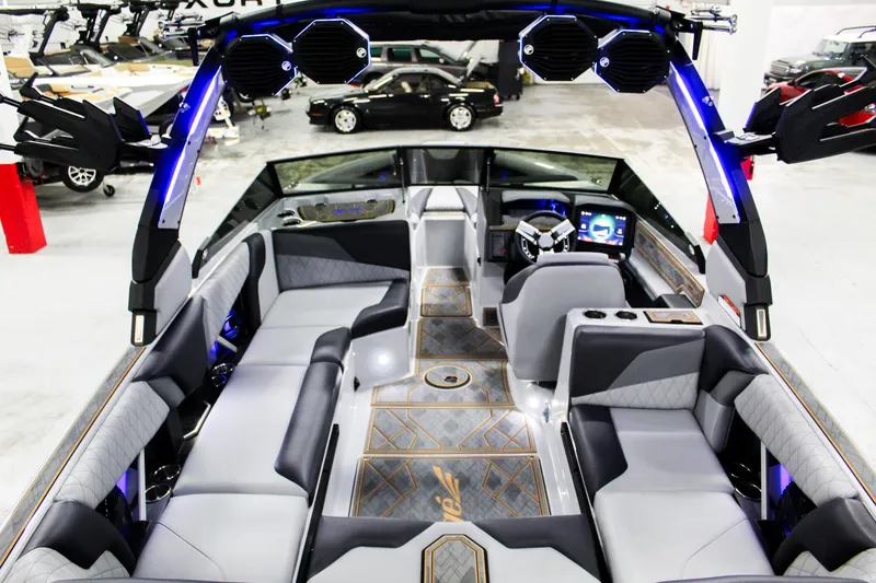 Slide: The Image of 2025 Tigé Z3 boat interior with modern seating and advanced dashboard features. - 8