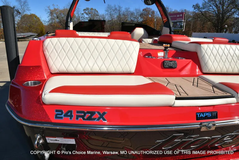 Slide: The Image of 2022 Tigé 24RZX boat with red and white seating, TAPS3T surf system. - 11