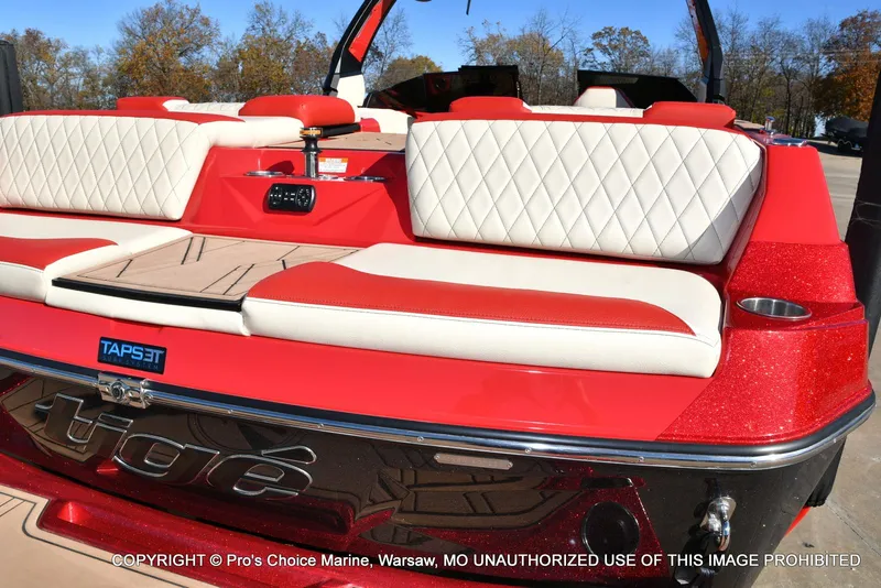 Slide: The Image of 2022 Tigé 24RZX boat with red and white seating, TAPSET system, and sleek design. - 12
