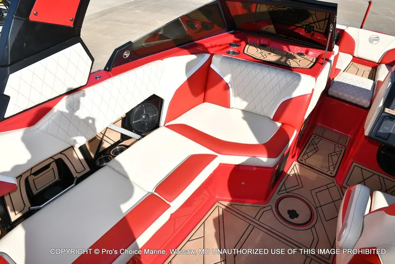 Slide: The Image of 2022 Tigé 24RZX boat interior with red and white seating, modern design. - 19