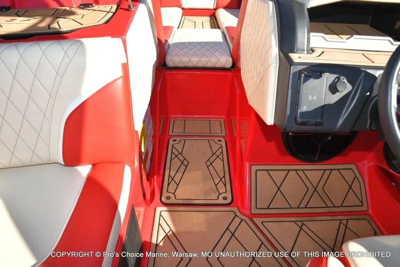 Slide: The Image of 2022 Tigé 24RZX boat interior with red and beige seating, stylish flooring. - 23