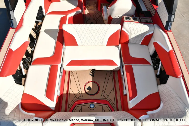 Slide: The Image of 2022 Tigé 24RZX boat interior with red and white seating, showcasing luxury design. - 36