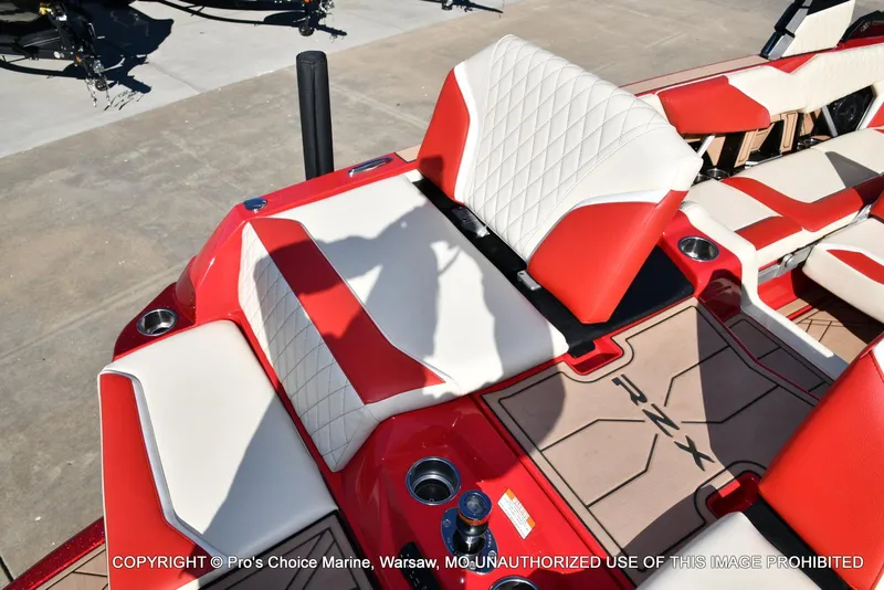 Slide: The Image of 2022 Tigé 24RZX boat interior with red and white seating and RZX branding. - 39