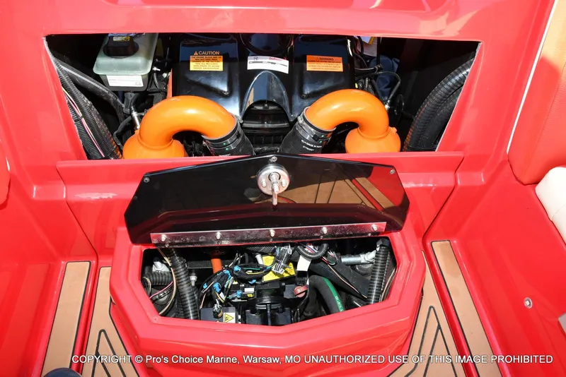 Slide: The Image of Engine compartment of a 2022 Tigé 24RZX boat with visible components and wiring. - 46