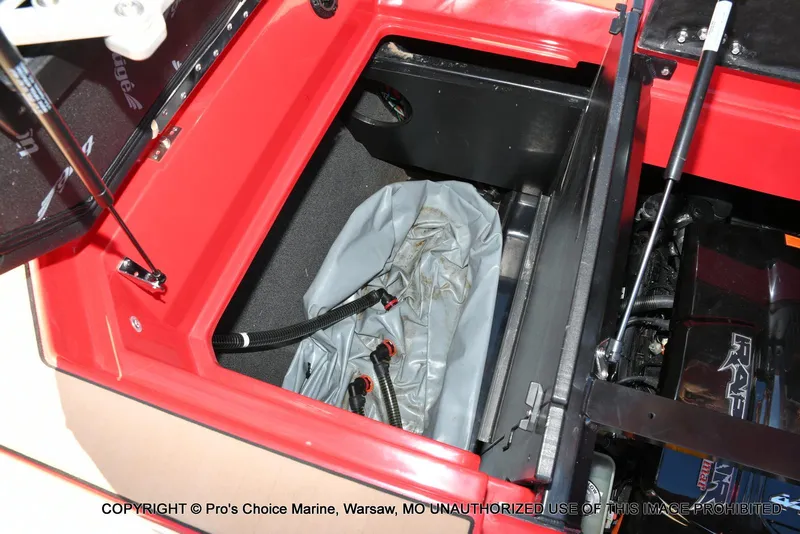 Slide: The Image of 2022 Tigé 24RZX boat storage compartment with hydraulic lift and hoses. - 49