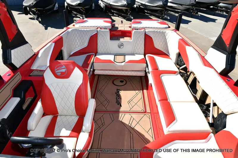 Slide: The Image of 2022 Tigé 24RZX boat interior with red and white seating, showcasing luxury design. - 7