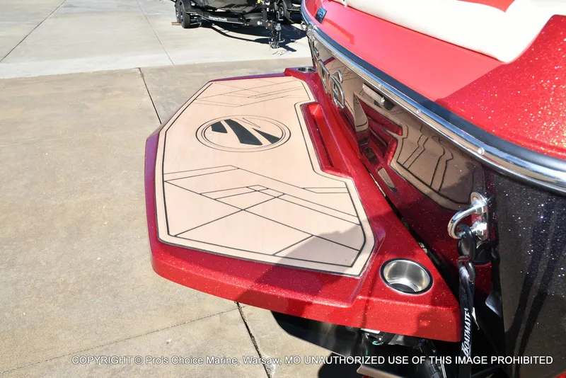 Slide: The Image of 2022 Tigé 24RZX boat with red and beige swim platform detail. - 8