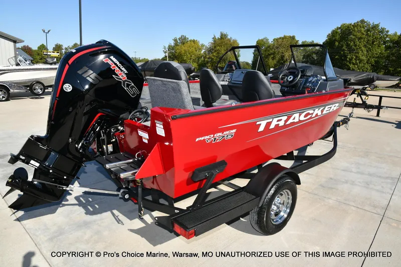 Slide: The Image of 2025 Tracker Pro Guide V-175 Combo boat with Mercury 115 Pro XS engine, parked outdoors. - 10