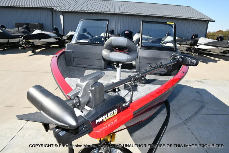 Slide: The Image of 2025 Tracker Pro Guide V-175 Combo boat with Minn Kota trolling motor, parked outdoors. - 18