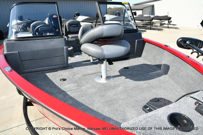 Slide: The Image of 2025 Tracker Pro Guide V-175 Combo boat interior with gray seating and red trim. - 20