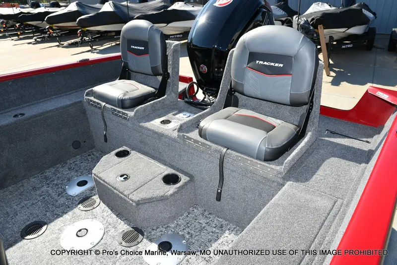 Slide: The Image of 2025 Tracker Pro Guide V-175 Combo boat interior with two seats and motor. - 24