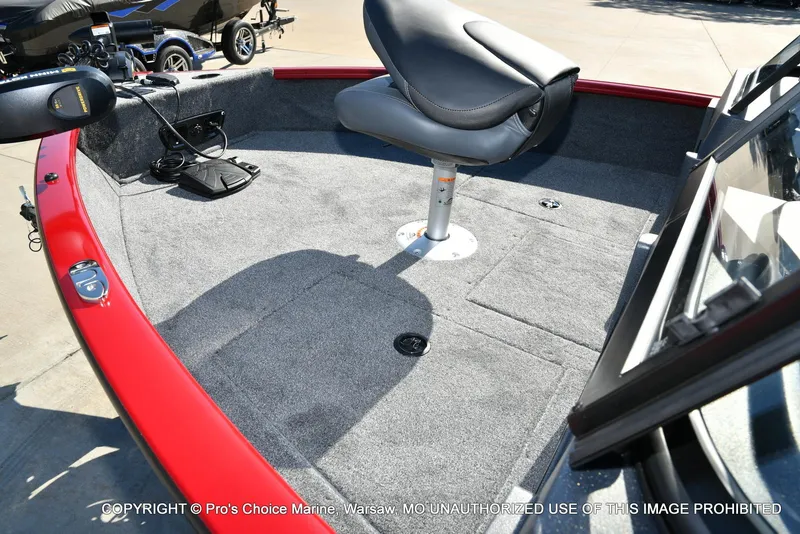 Slide: The Image of 2025 Tracker Pro Guide V-175 Combo boat interior with gray carpet and swivel seat. - 26