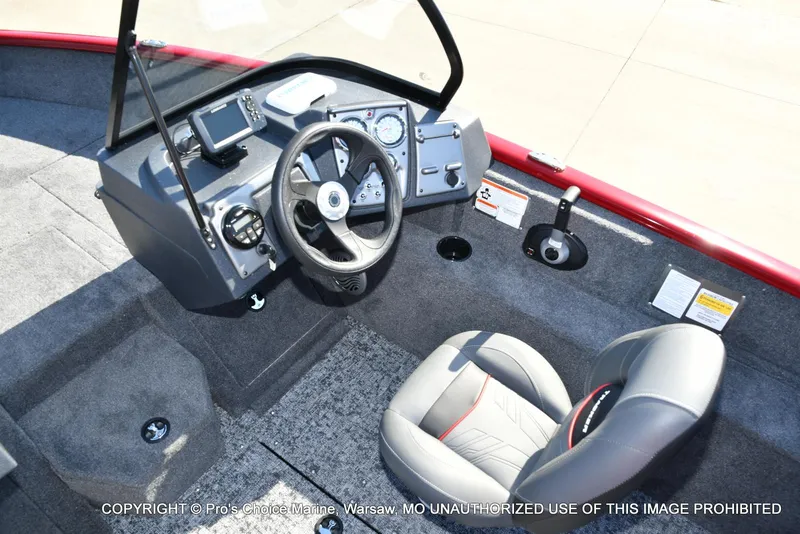 Slide: The Image of 2025 Tracker Pro Guide V-175 Combo boat interior with steering wheel and control panel. - 29