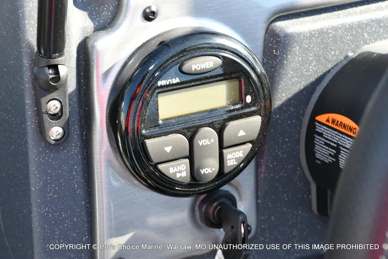 Slide: The Image of Control panel of 2025 Tracker Pro Guide V-175 Combo boat with power and volume buttons. - 33
