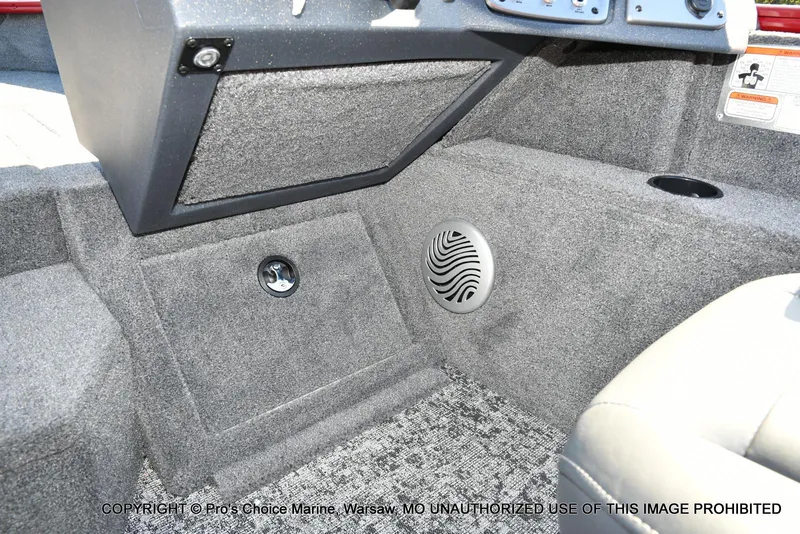 Slide: The Image of Interior of 2025 Tracker Pro Guide V-175 Combo boat, featuring speaker and storage compartment. - 38