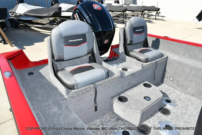 Slide: The Image of 2025 Tracker Pro Guide V-175 Combo boat interior with dual seats and motor. - 4