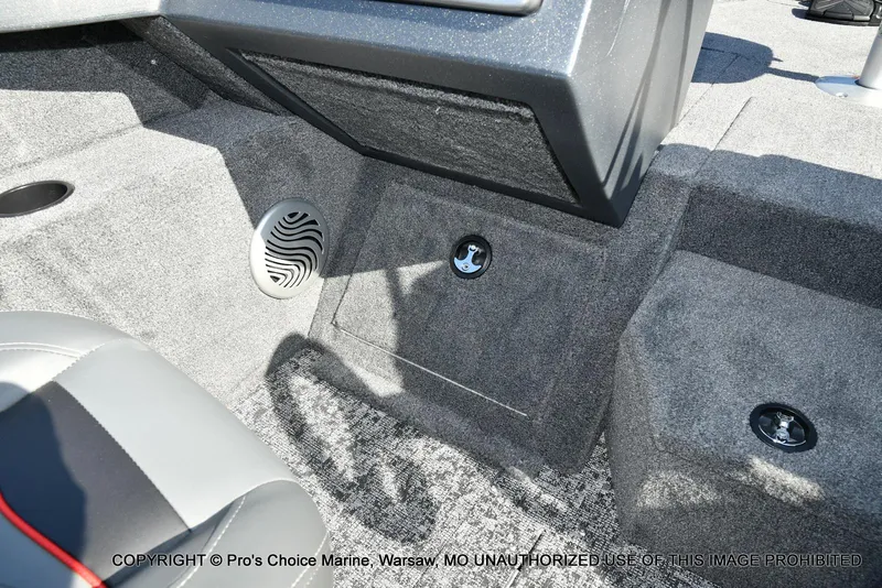 Slide: The Image of Interior of 2025 Tracker Pro Guide V-175 Combo boat, featuring carpeted flooring and speaker. - 40