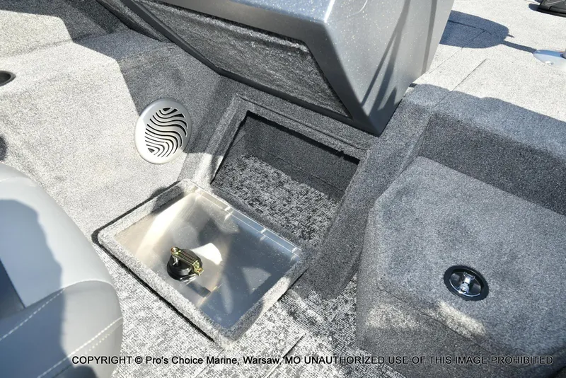 Slide: The Image of 2025 Tracker Pro Guide V-175 Combo boat interior with storage compartment and speaker. - 41
