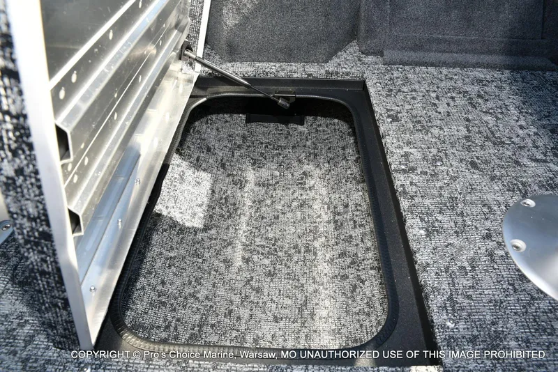Slide: The Image of 2025 Tracker Pro Guide V-175 Combo boat storage compartment with carpeted interior. - 43