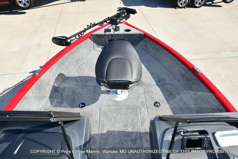 Slide: The Image of 2025 Tracker Pro Guide V-175 Combo boat interior with seating and fishing equipment. - 45