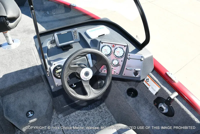 Slide: The Image of 2025 Tracker Pro Guide V-175 Combo boat dashboard with steering wheel and navigation system. - 6