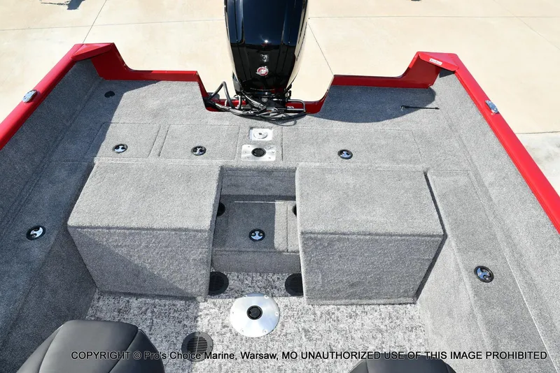 Slide: The Image of 2025 Tracker Pro Guide V-175 Combo boat interior with gray carpet and red accents. - 8