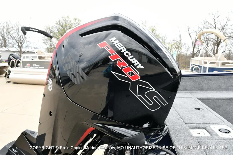 Slide: The Image of 2025 Tracker Pro Guide V-175 with Mercury Pro XS engine, docked near pontoon boats. - 3