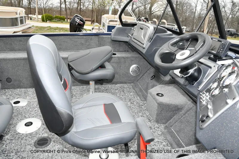 Slide: The Image of Interior of 2025 Tracker Pro Guide V-175 Walk-Thru boat with modern seating and controls. - 5