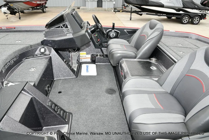 Slide: The Image of 2018 Ranger Z520L CUP boat interior with dual seats and control panel. - 12