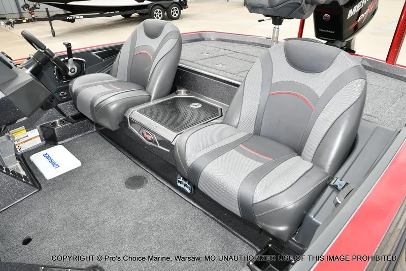 Slide: The Image of 2018 Ranger Z520L CUP boat interior with dual gray seats and steering console. - 13