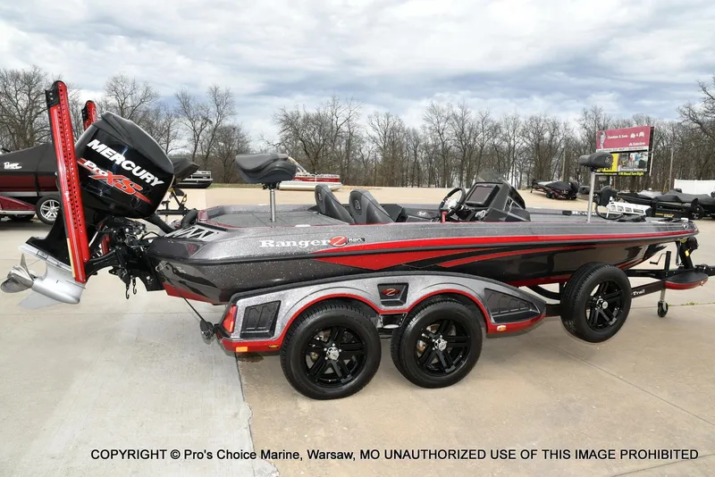 Slide: The Image of 2018 Ranger Z520L CUP boat with Mercury engine, parked on concrete, showcasing sleek design. - 17
