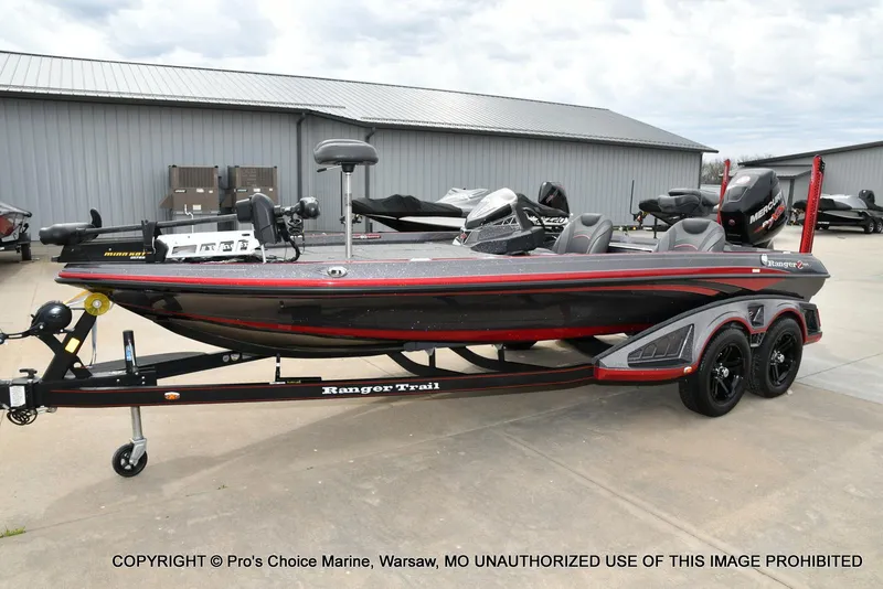 Slide: The Image of 2018 Ranger Z520L CUP fishing boat on trailer, parked outside a warehouse. - 25