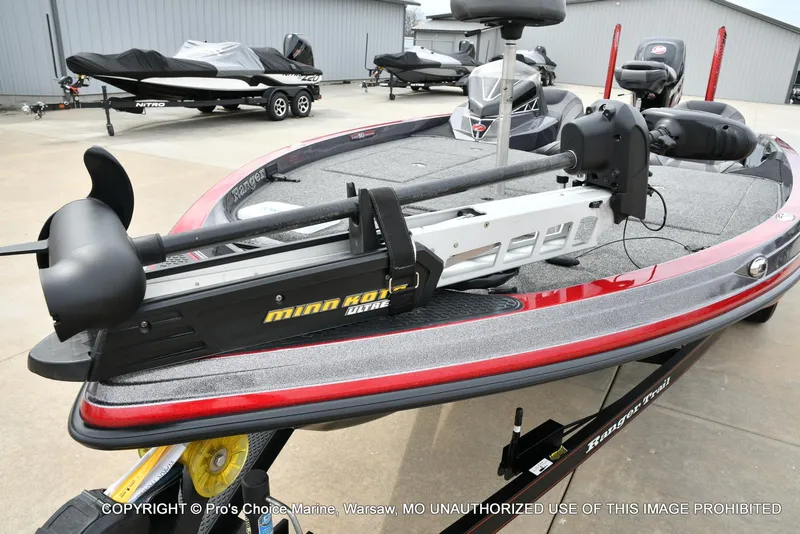 Slide: The Image of 2018 Ranger Z520L CUP boat with Minn Kota trolling motor in a marina setting. - 27