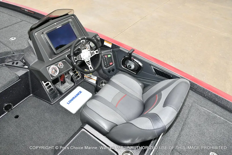 Slide: The Image of 2018 Ranger Z520L CUP boat cockpit with steering wheel, Lowrance display, and comfortable seating. - 41
