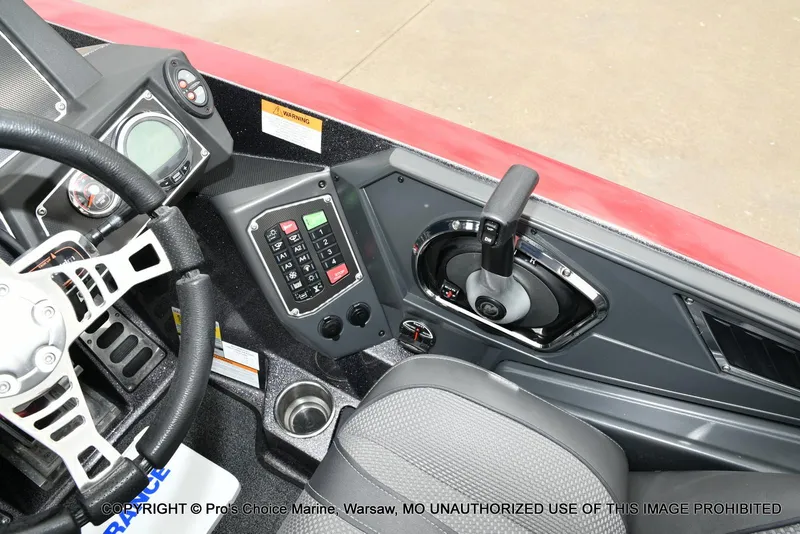 Slide: The Image of 2018 Ranger Z520L CUP boat cockpit with steering wheel, control panel, and throttle lever. - 43