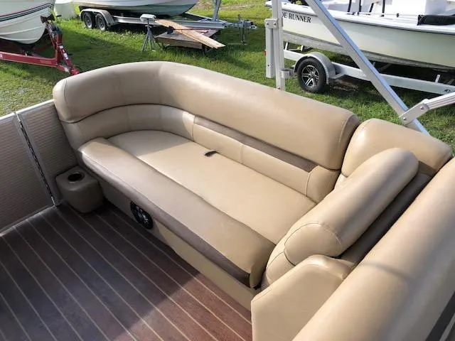 Slide: The Image of Luxurious seating on 2020 Sweetwater 2286 pontoon boat with tan upholstery. - 13