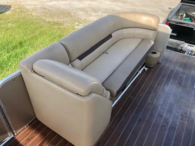 Slide: The Image of Beige leather seating on 2020 Sweetwater 2286 boat with wooden deck. - 15