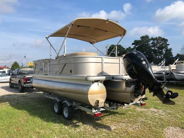 Slide: The Image of 2020 Sweetwater 2286 pontoon boat on trailer with canopy and outboard motor. - 6