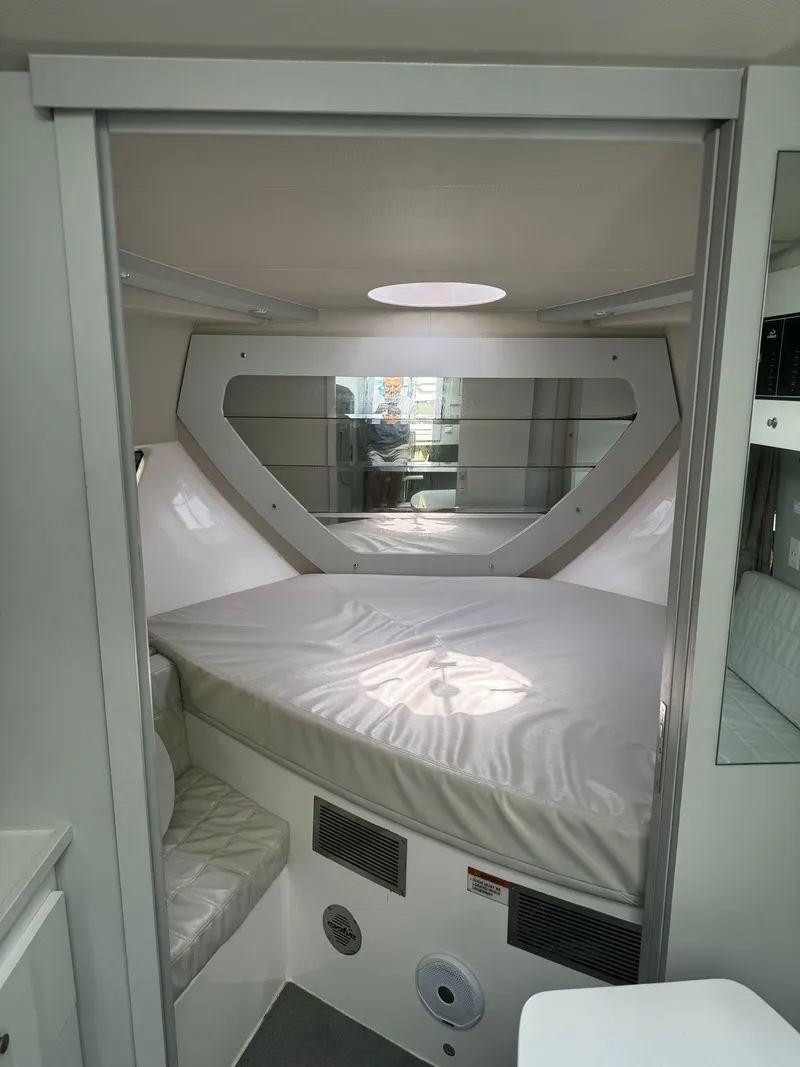 Slide: The Image of Interior cabin of 2021 Evolve 400HT, featuring a cozy sleeping area with curtains. - 11