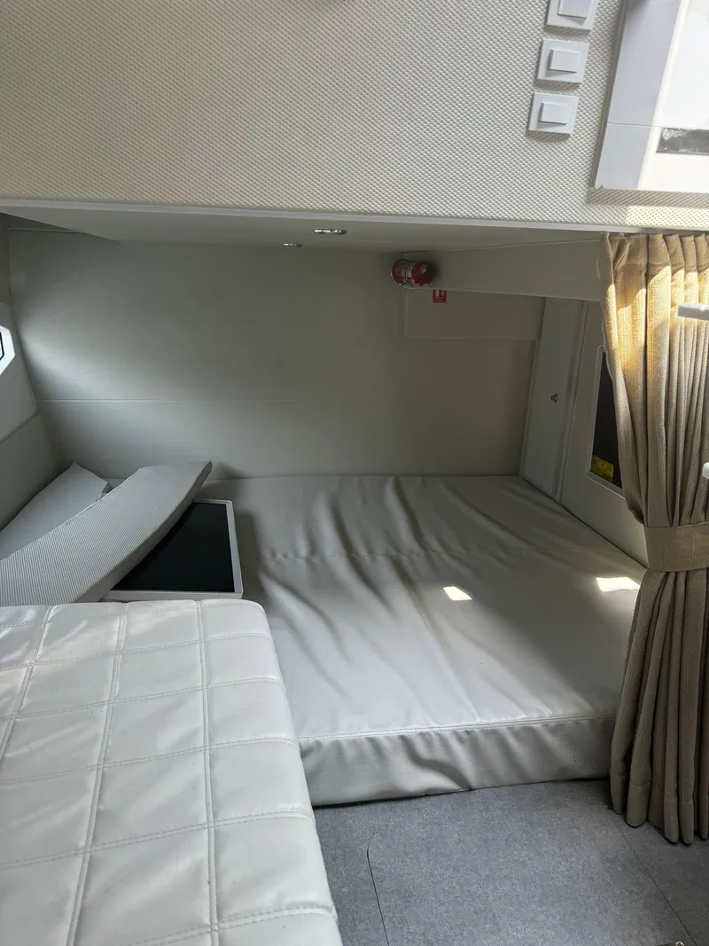 Slide: The Image of Interior of 2021 Evolve 400HT yacht with kitchenette and cozy sleeping area. - 12