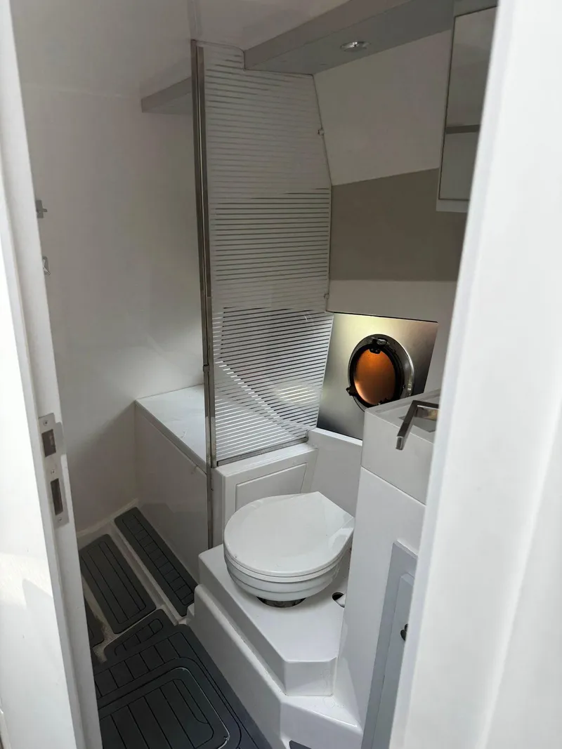 Slide: The Image of Evolve 400HT 2021 boat docked with twin Mercury 350 engines. - 14