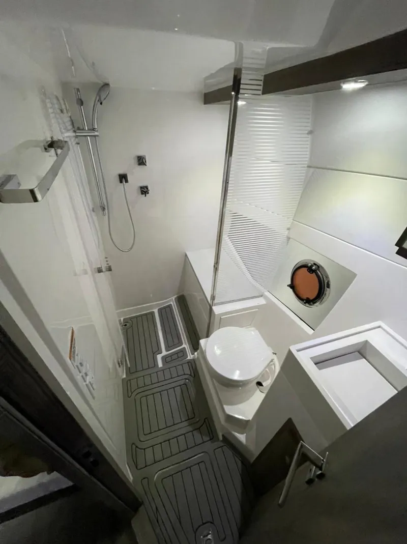 Slide: The Image of Interior of 2021 Evolve 400HT boat with sleek seating and modern design. - 5