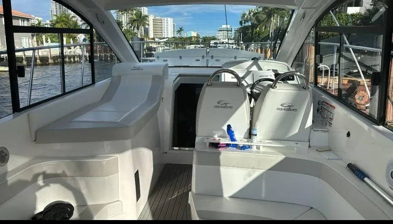 Slide: The Image of 2021 Evolve 400HT yacht interior with modern seating and sleek design. - 8