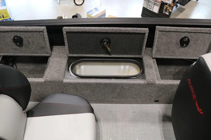 Slide: The Image of 2023 Alumacraft Competitor 185 CS boat interior with storage compartments and seating. - 14