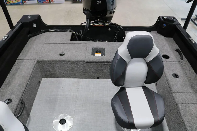 Slide: The Image of 2023 Alumacraft Competitor 185 CS boat interior with seating and motor. - 19