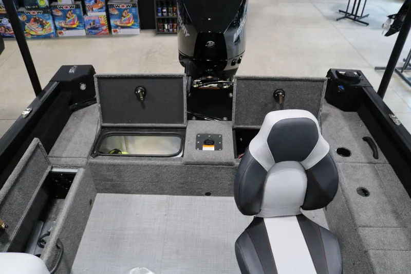 Slide: The Image of 2023 Alumacraft Competitor 185 CS boat interior with seating and storage compartments. - 20