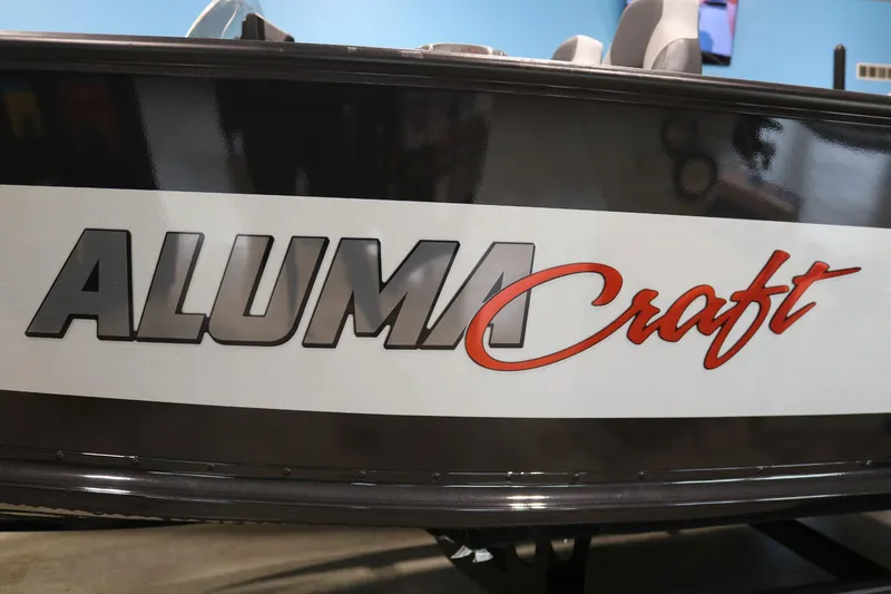 Slide: The Image of 2023 Alumacraft Competitor 185 CS boat logo on side panel. - 23