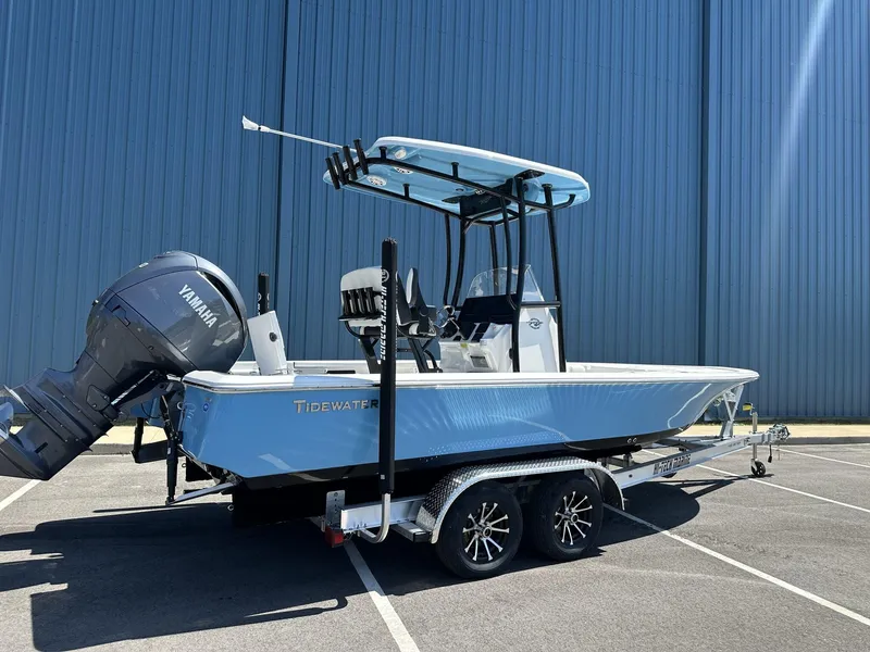Slide: The Image of 2025 Tidewater 2110 Bay Max boat with Yamaha engine on trailer, parked outdoors. - 4