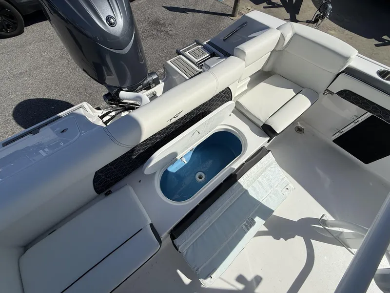 Slide: The Image of 2025 Tidewater 220 LXF boat interior with seating and livewell. - 14